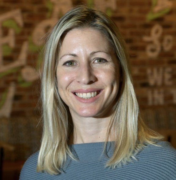 Photo shows female with shoulder length blonde hair, smiling