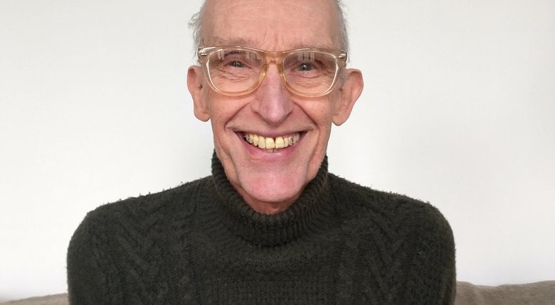 Aly Prince looking into the lens from his home.