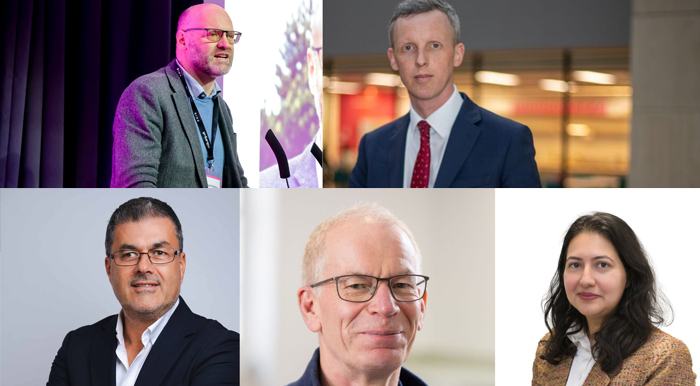 A collage of five professional portraits. Top left: Nigel Fletcher speaking at a podium with a microphone, wearing glasses and a grey blazer, with purple lighting behind them. Top right: Andrew McCracken in a blue suit and red tie standing indoors with warm, blurred lights in the background. Bottom left: Barry Hoffman in a dark suit with arms crossed against a plain light backdrop. Bottom centre: Graham Colbert wearing glasses and a blue sweater, softly lit. Bottom right: Zayna Ali in a brown tweed jacket and white shirt against a white background.