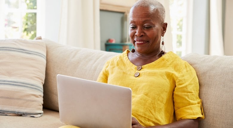 A woman using her laptop to browse the internet