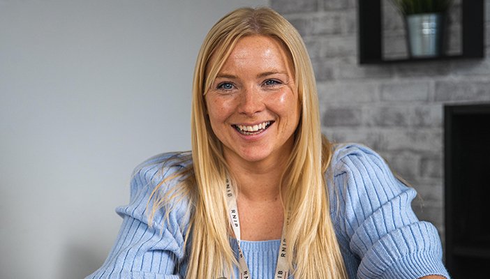 Eye Care Liaison Officer (ECLO), Jenny smiling directly at the camera.