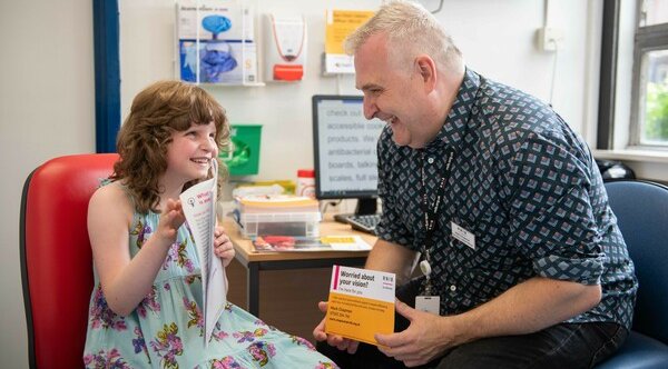 A middle aged man named Mark Chapman, who is an ECLO, talking to a young girl named Chrissy French